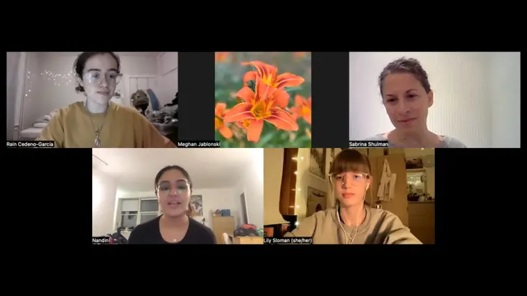 Five people in a virtual meeting with a central image of an orange flower. Each has a distinct background.
