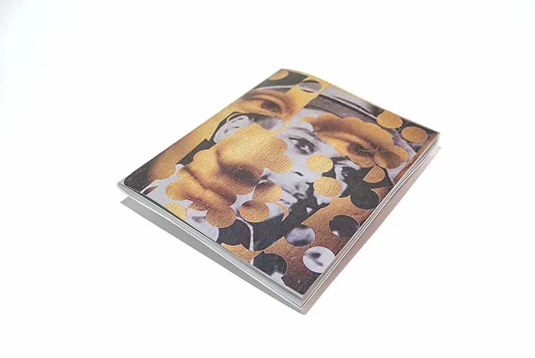 Book with an abstract collage cover featuring overlapping circular and facial elements in gold and grayscale.