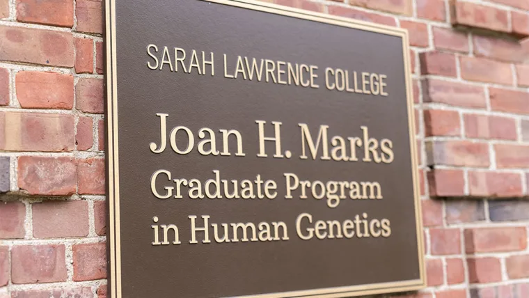 Plaque on a brick wall reads: "Sarah Lawrence College, Joan H. Marks Graduate Program in Human Genetics."