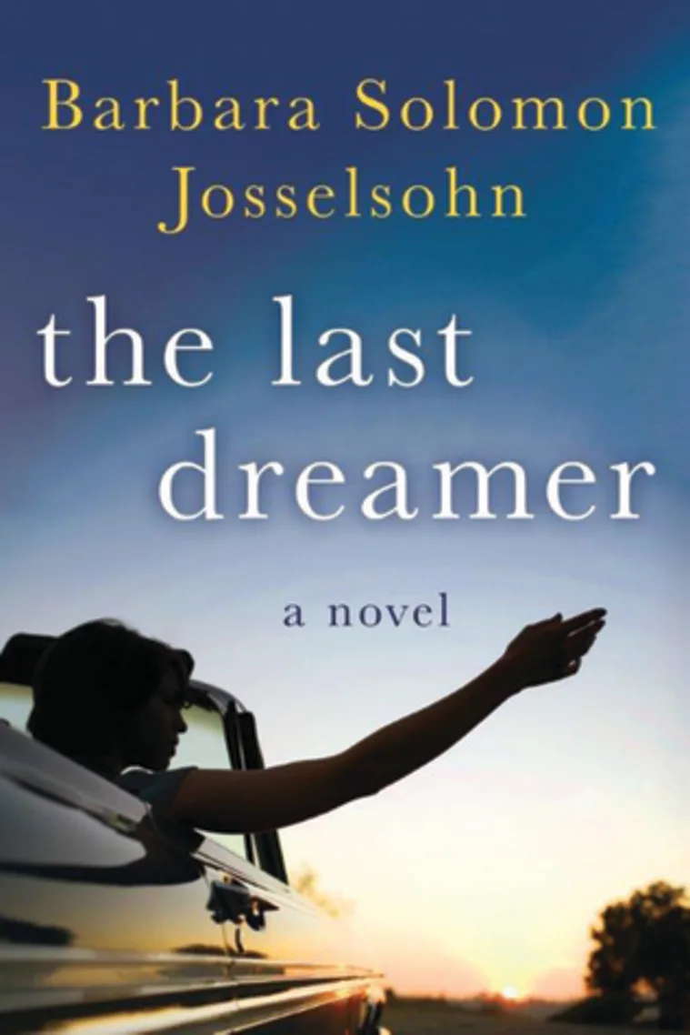 Book cover of "The Last Dreamer" by Barbara Solomon Josselsohn, featuring a silhouette of a person reaching out of a car at sunset.