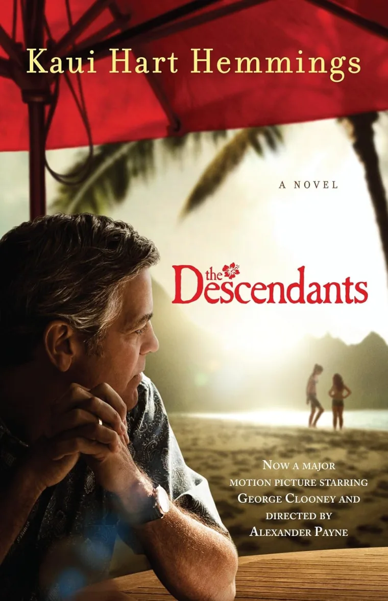 Person seated under a red umbrella, gazing at a beach with two figures in the distance. Text: "Kaui Hart Hemmings, The Descendants."