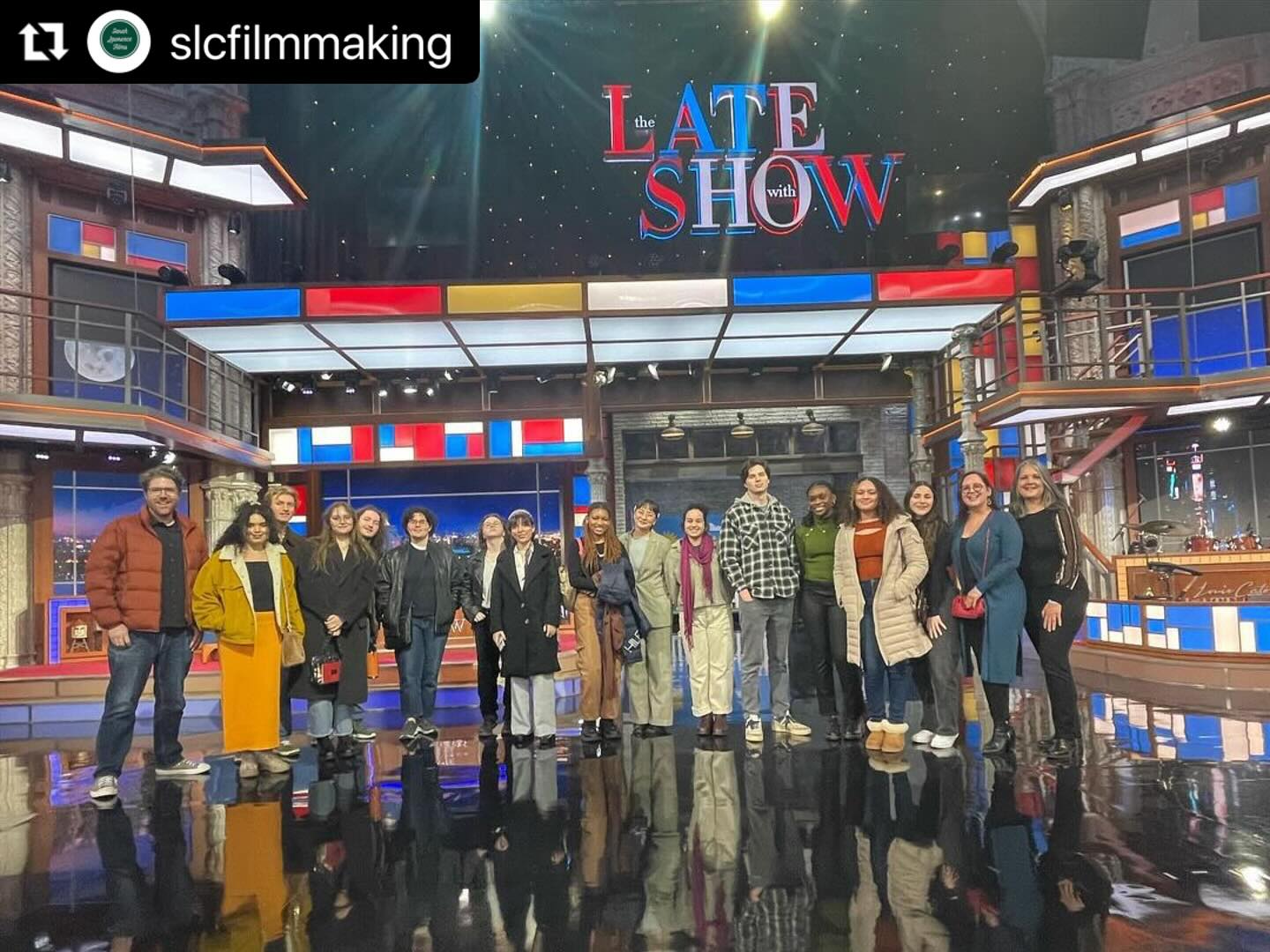 Students standing outside in front of the Late Show Theater.