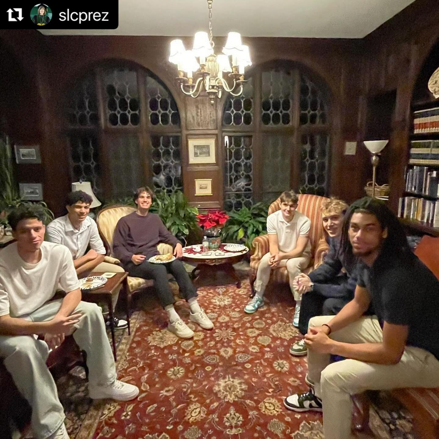 Group of people sitting in a living room.