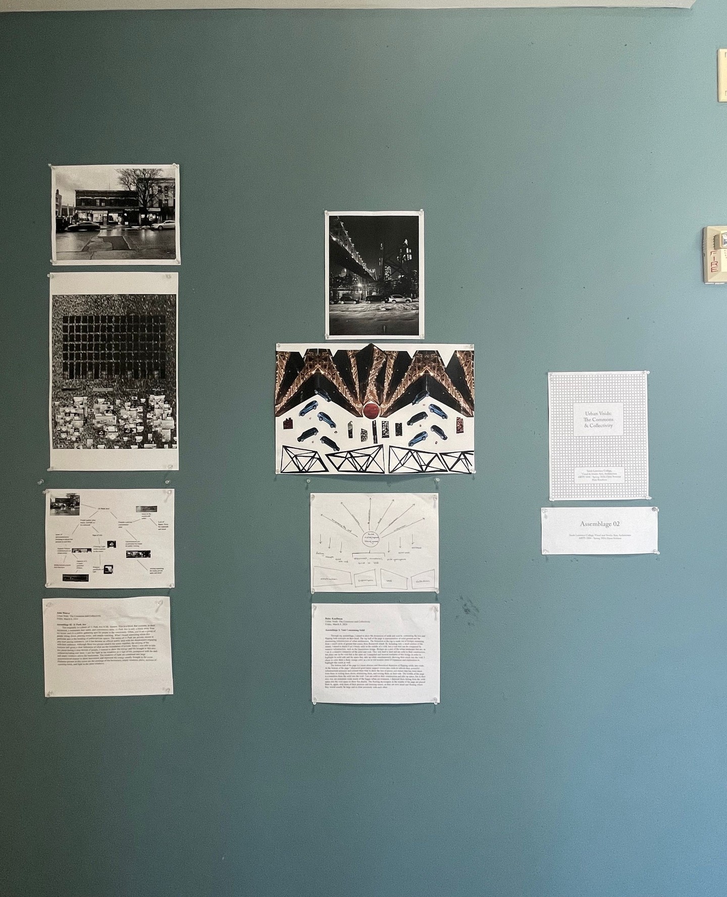 A gallery wall with a mix of black and white photos and informational posters.