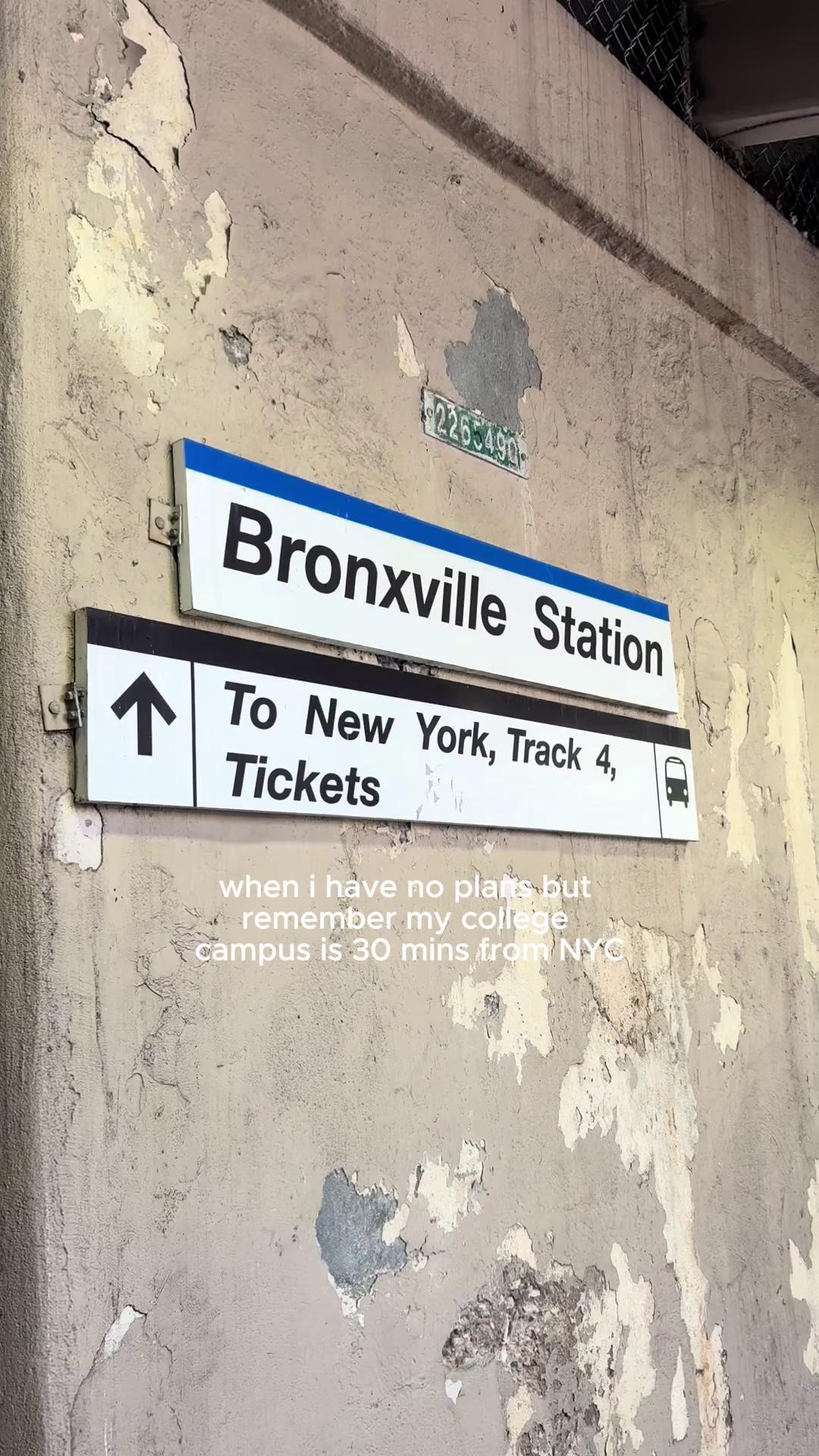 Bronxville Station sign on a weathered wall, text mentions college campus is 30 minutes from NYC.
