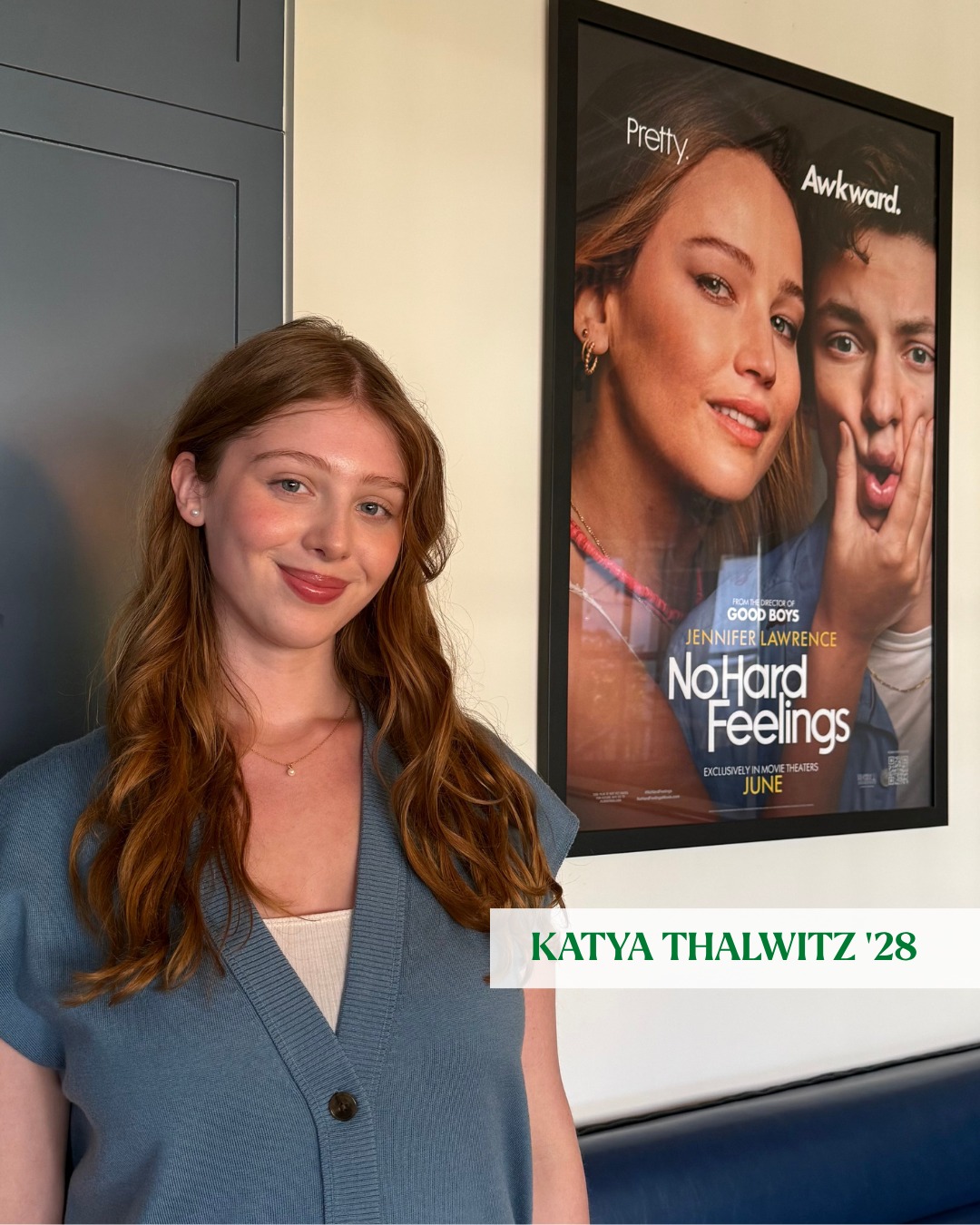 Person smiling in front of a poster for the movie "No Hard Feelings." Name label says "Katya Thalwitz '28."