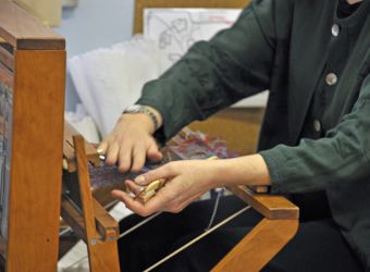 Demonstrating weaving during a workshop