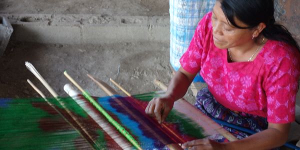 Beginning to weave a painted warp