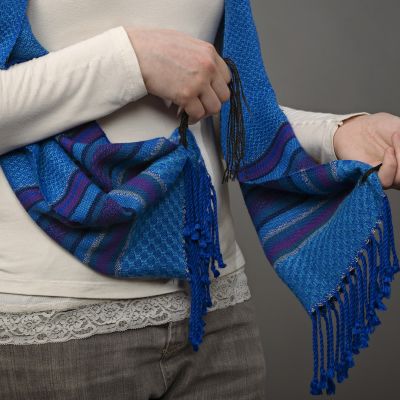 The woven pattern in the border resembles tiny Torah scrolls on this prayer shawl