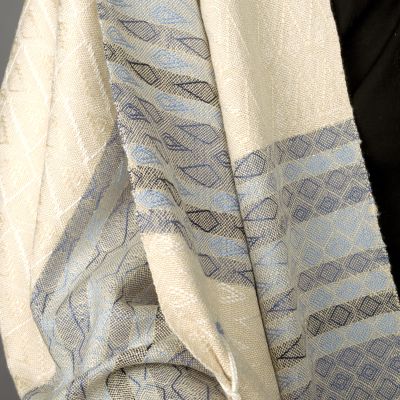 Patterning in the border of Tikkun Olam prayer shawl