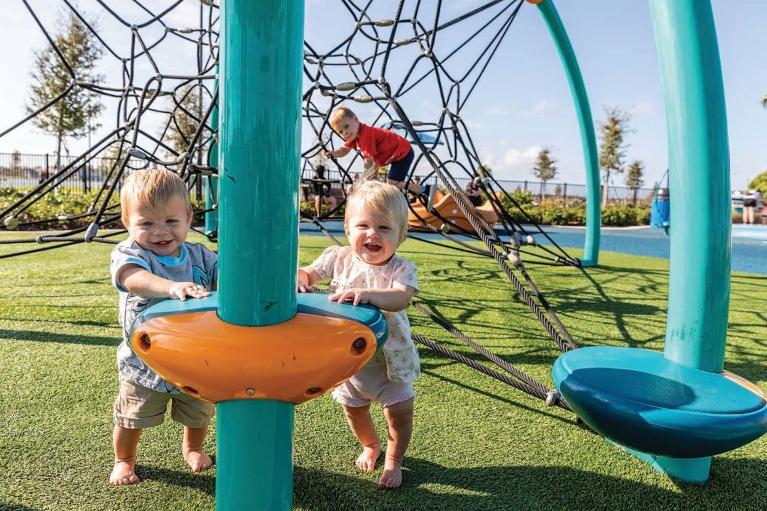 Waterside Park is an 8-acre island on Kingfisher Lake that includes a splash pad, volleyball courts and more.