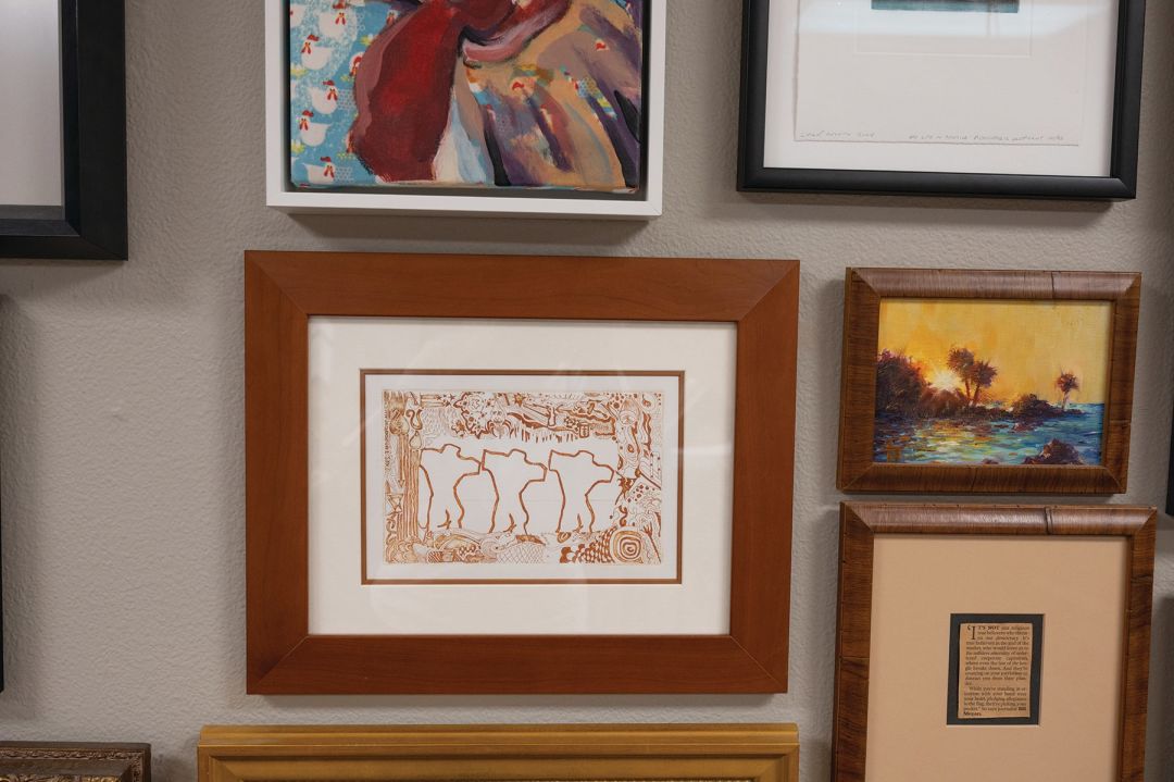Some of Goggans' own work adorns the wall.