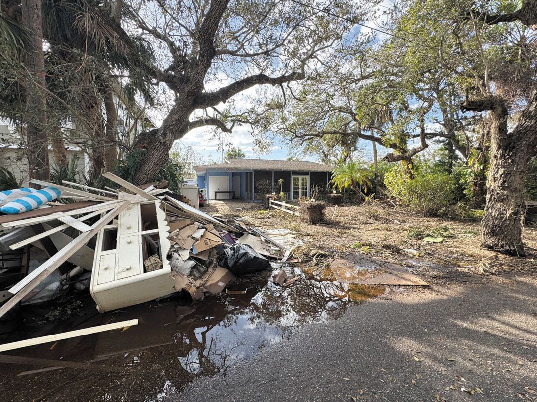 Destroyed items on the curb in front of Green’s home.