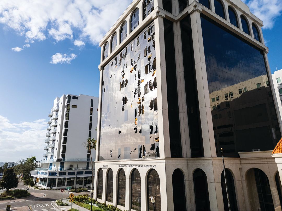Shattered windows in a downtown Sarasota office building