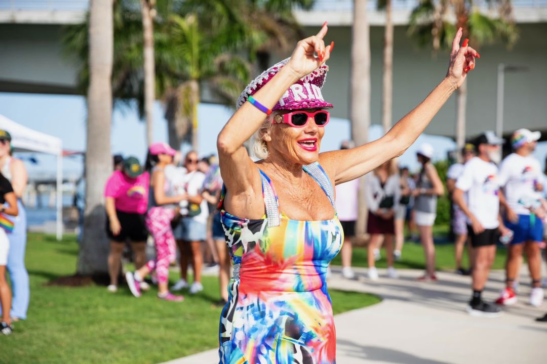 A local woman celebrates at the Grand Pride Flag March.