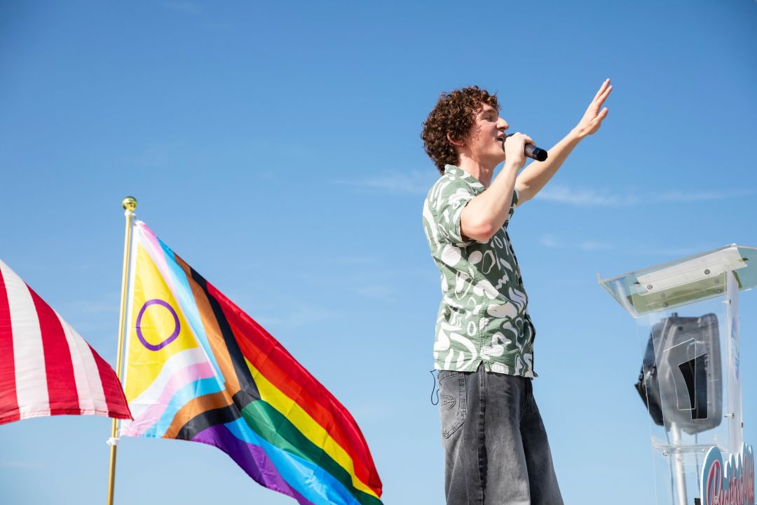 Activist Zander Moricz, founder and executive director at the Social Equity through Education (SEE) Alliance, speaks before the Grand Pride Flag March.