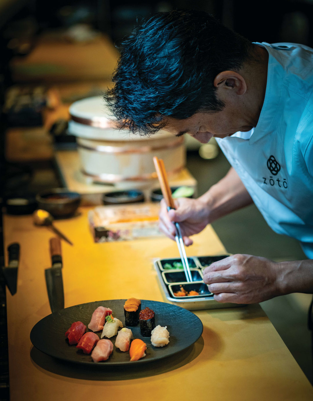 Atsushi Okawara plates sushi and sashimi options from Zōtō’s menu.