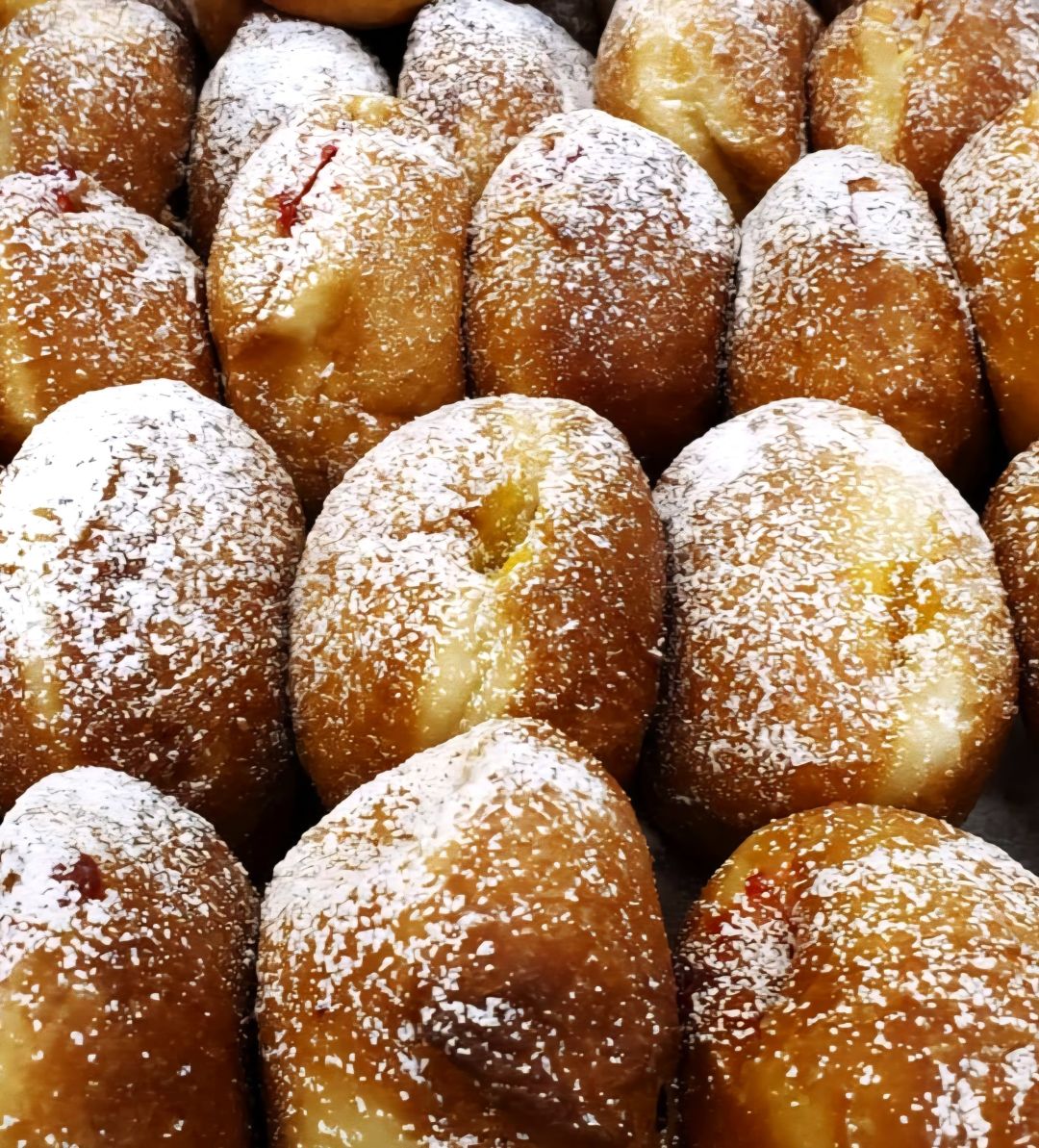 Paczki—pronounced "punch-key" or "ponch-key"—are the Polish equivalent of fried jelly donuts.
