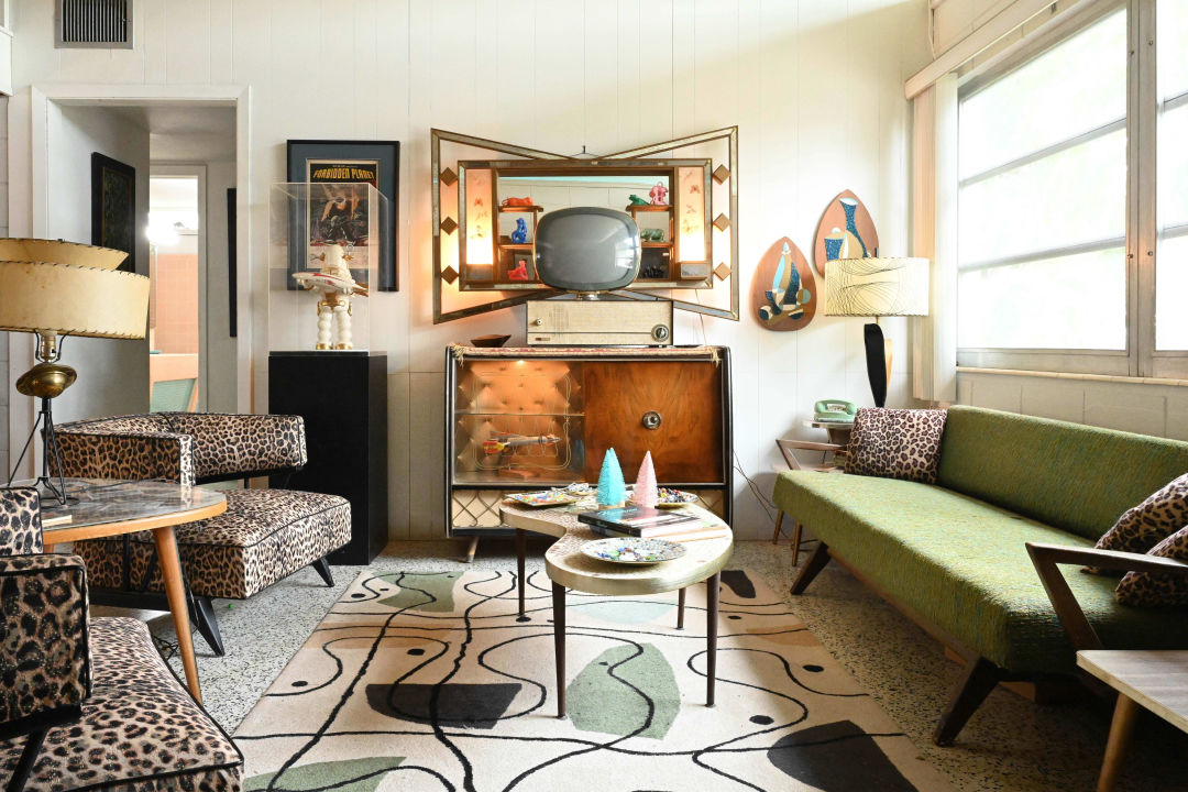 Original period furnishings and rotary phones, art and collectibles make this home a 1950s time capsule.