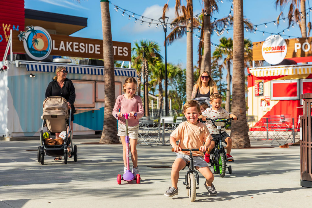Grand Lake is an 80-acre expanse ringed by a three-mile pedestrian boulevard busy with parents pushing strollers, dogs tugging their owners and joggers running loops at sunset.