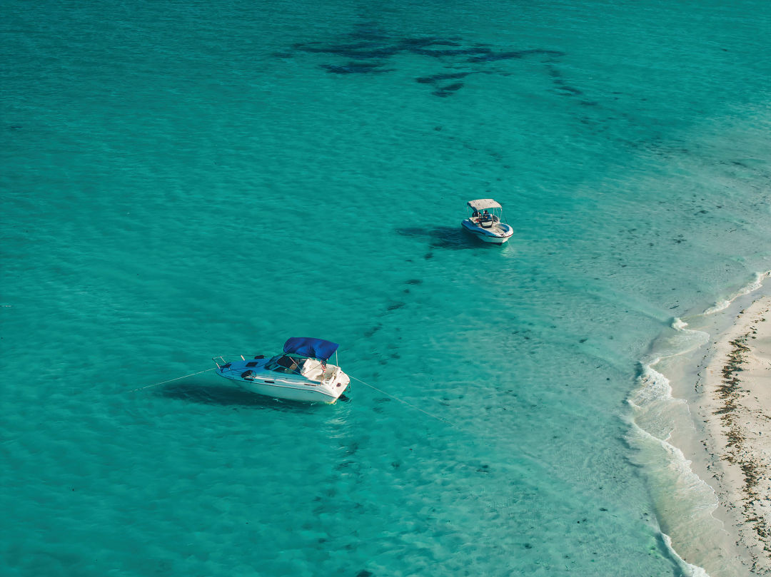 Crowds are drawn to a sprawling expanse of waist-deep, gin-clear water over white quartz sand that stretches as far as you can wade.