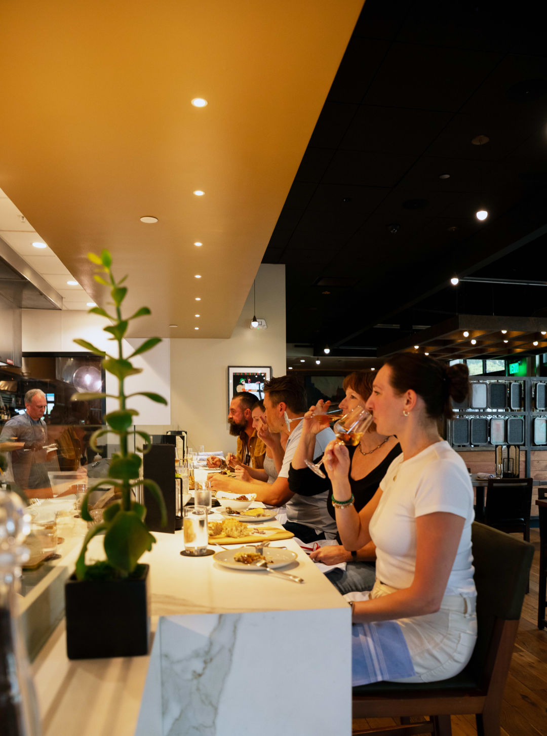 The kitchen bar isn’t set up as a true chef’s counter, where the chef will cook and serve customers, but if you look longingly or ask questions, the cooks will deliver little treats from a globally inspired menu if they have time.