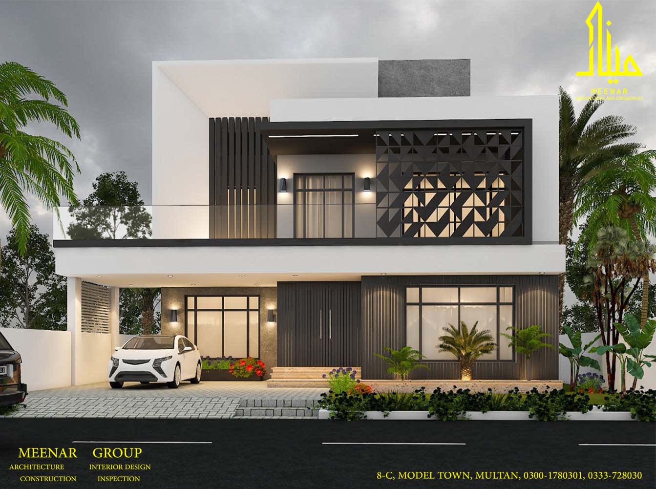 Modern white house with a patterned black screen and landscaped front