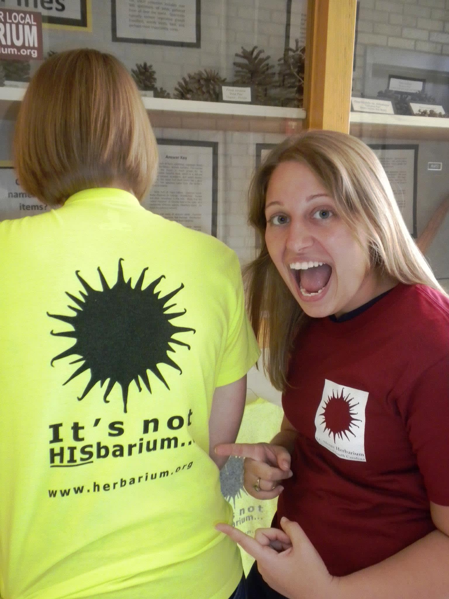 Student laughs at another's shirt which reads "It's not HISbariu..."