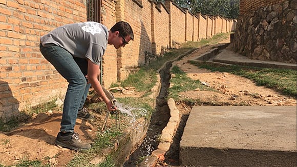 Engineering student constructing water system