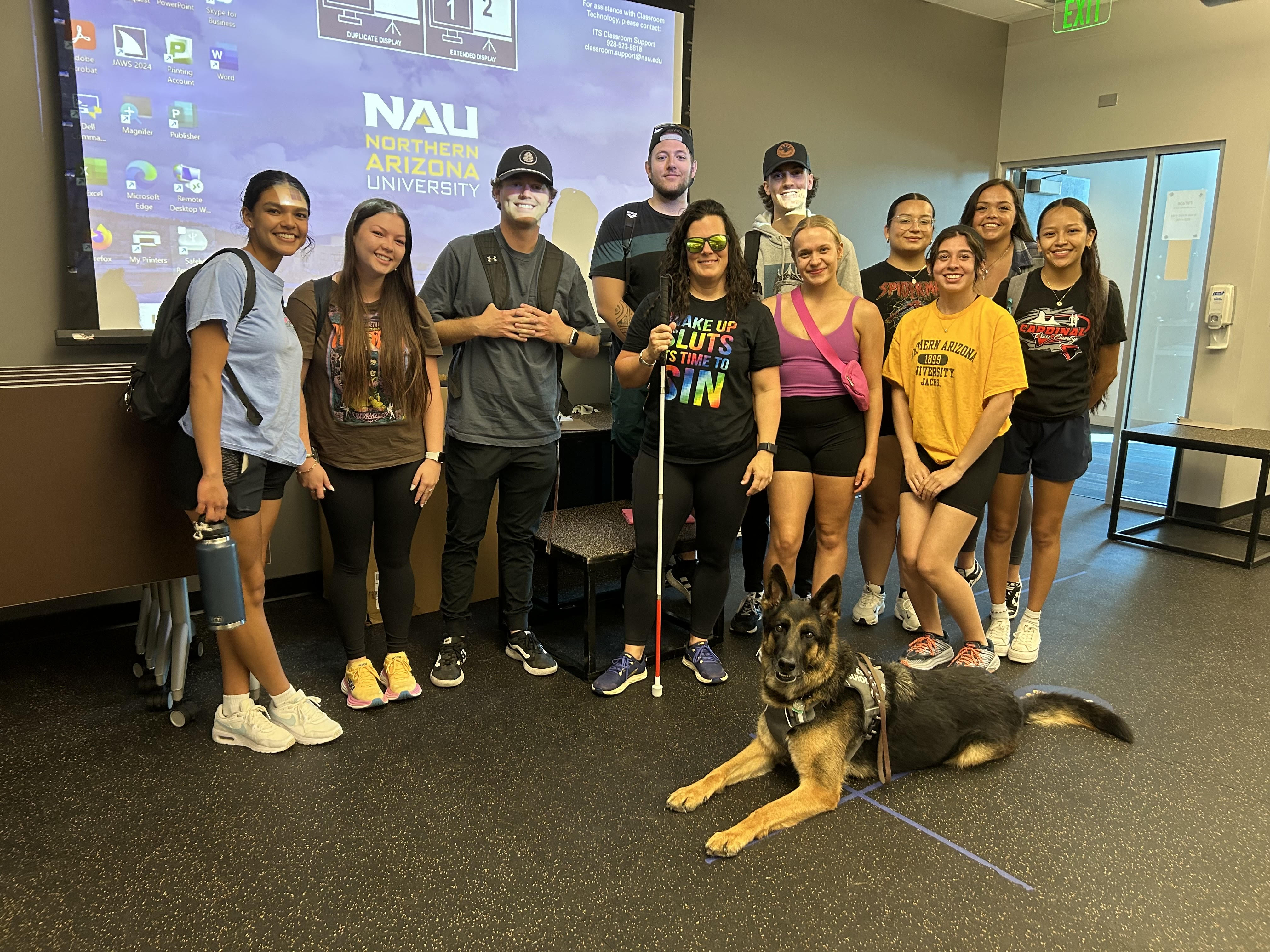 Fitness Wellness students group photo with dog