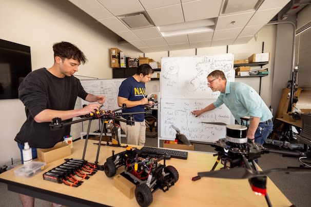 Students and professor in SICCS lab