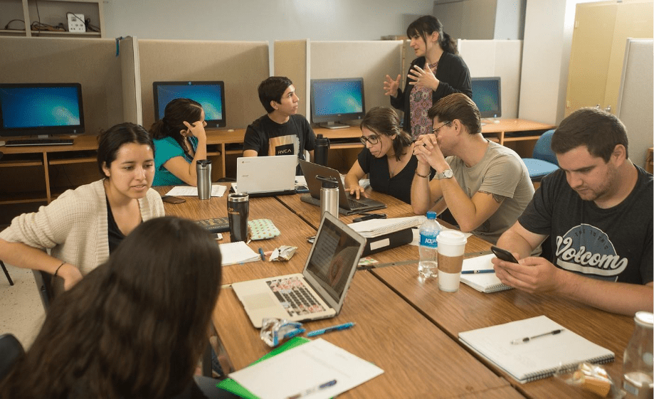 A group of people sitting around a table 
AI-generated content may be incorrect.