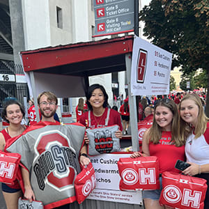 Group of Ohio Staters students selling seat cushions