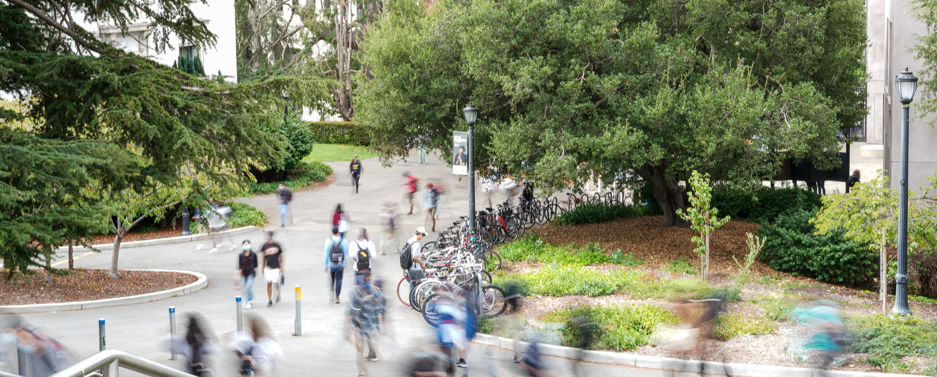 Path on campus with blurry people walking