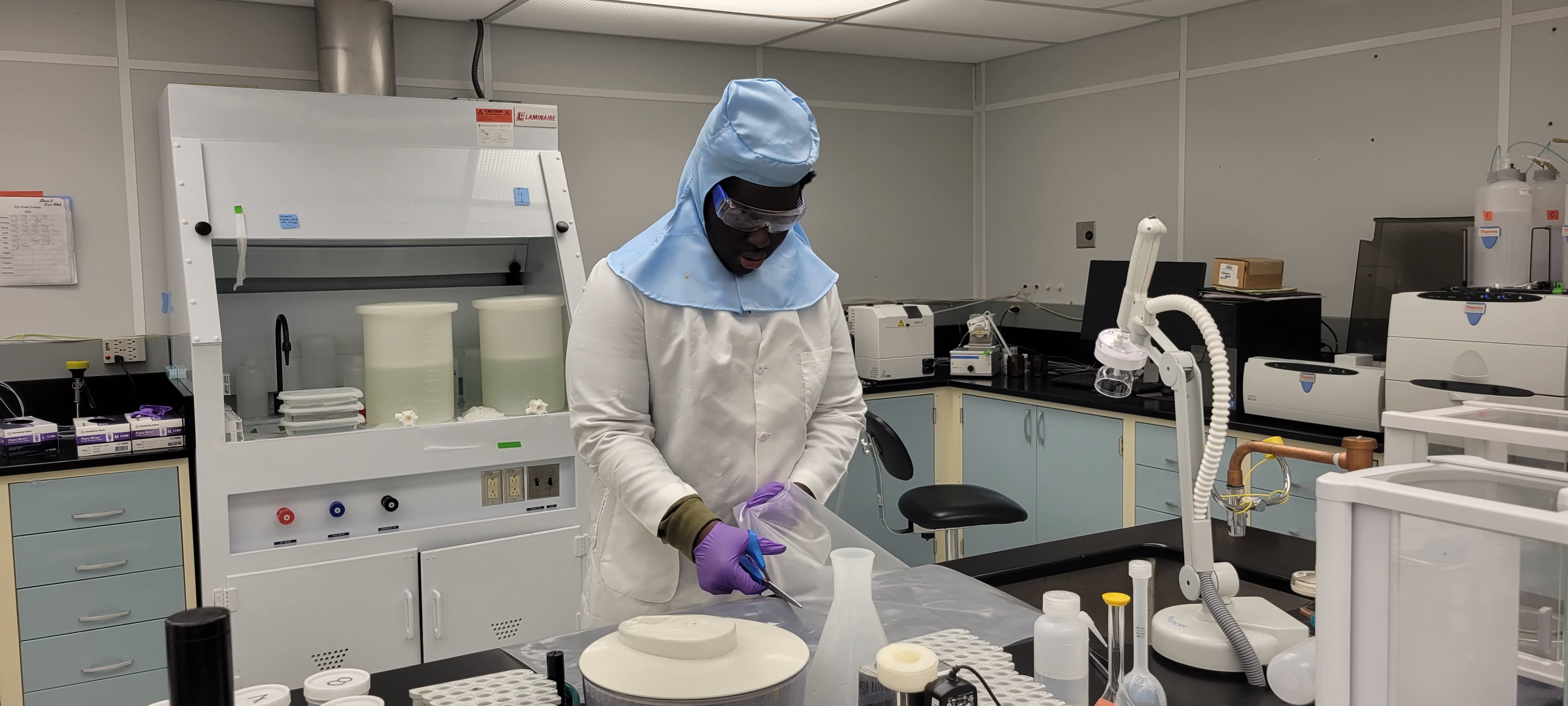 Intern working with scientific materials in a lab