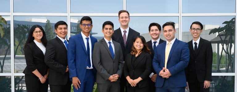 9 Titan Capital Management students in suits