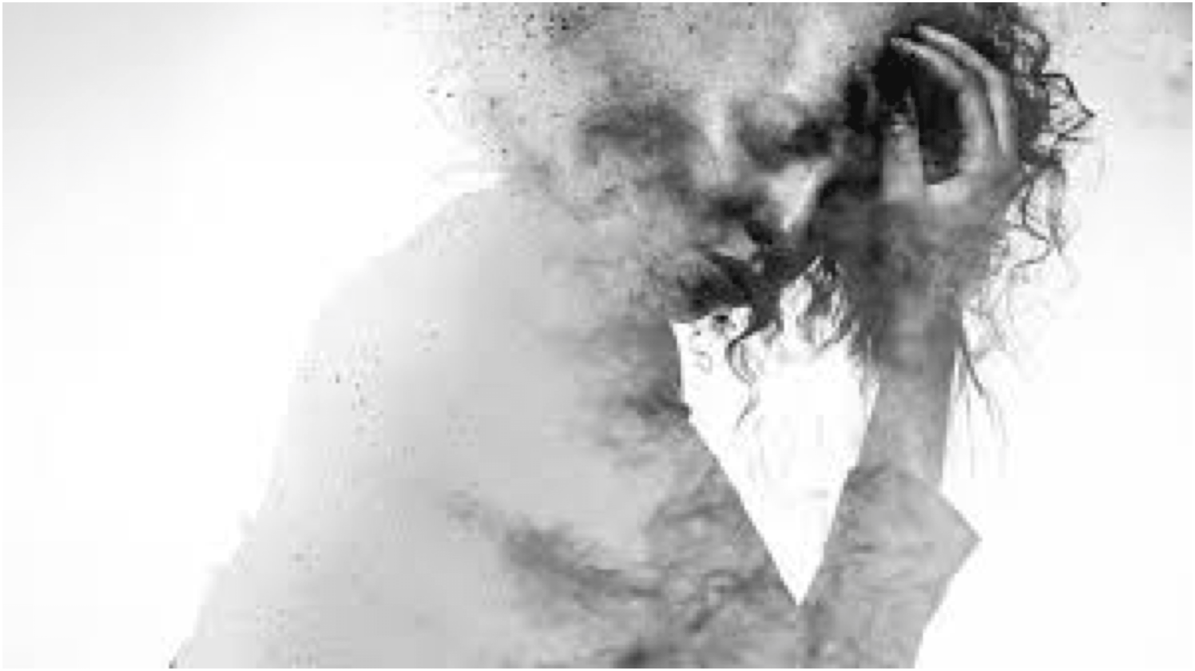 A woman posed with her hand covering part of her face and hair. The back half of her is fading away