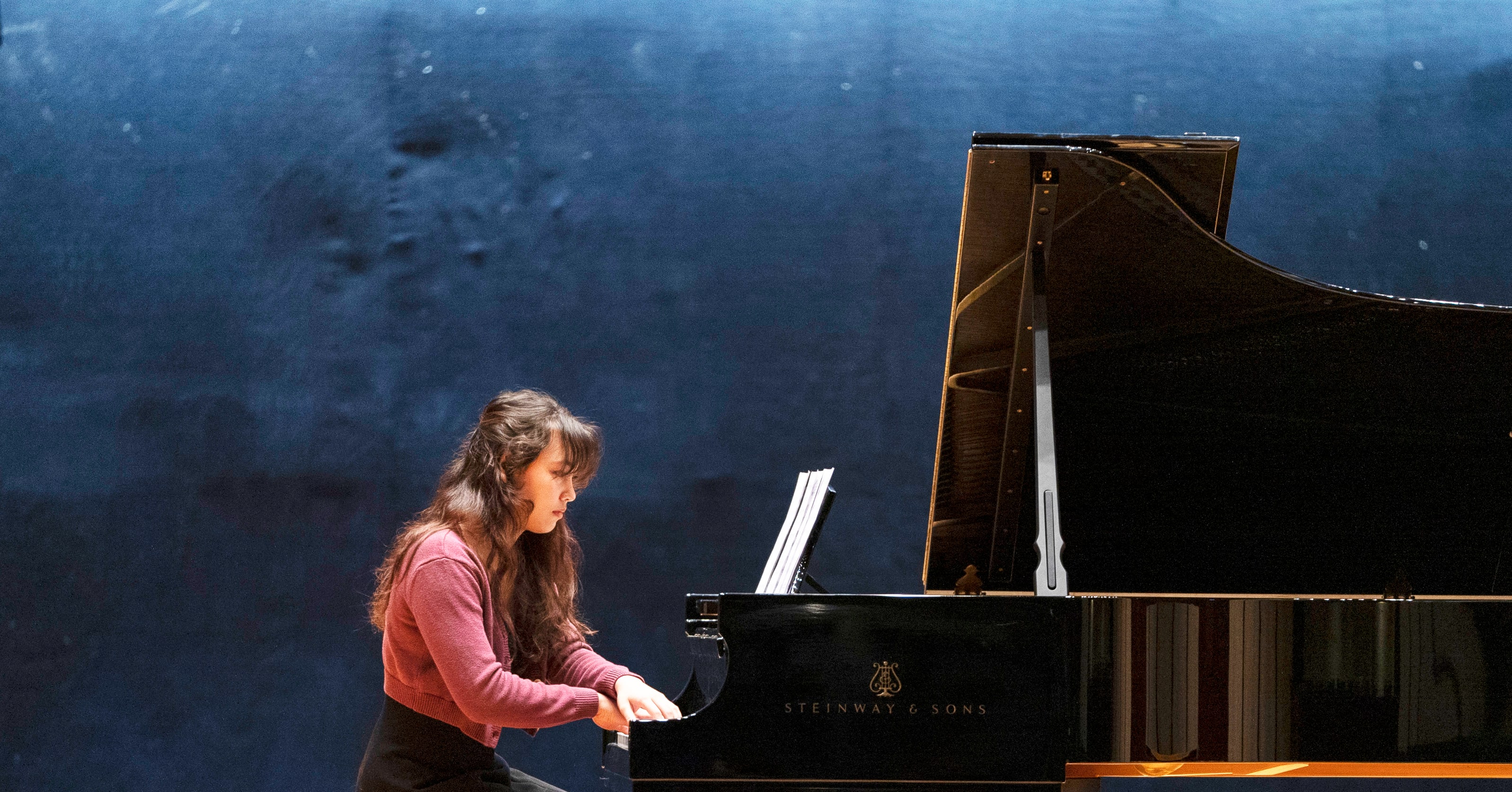 a student playing piano