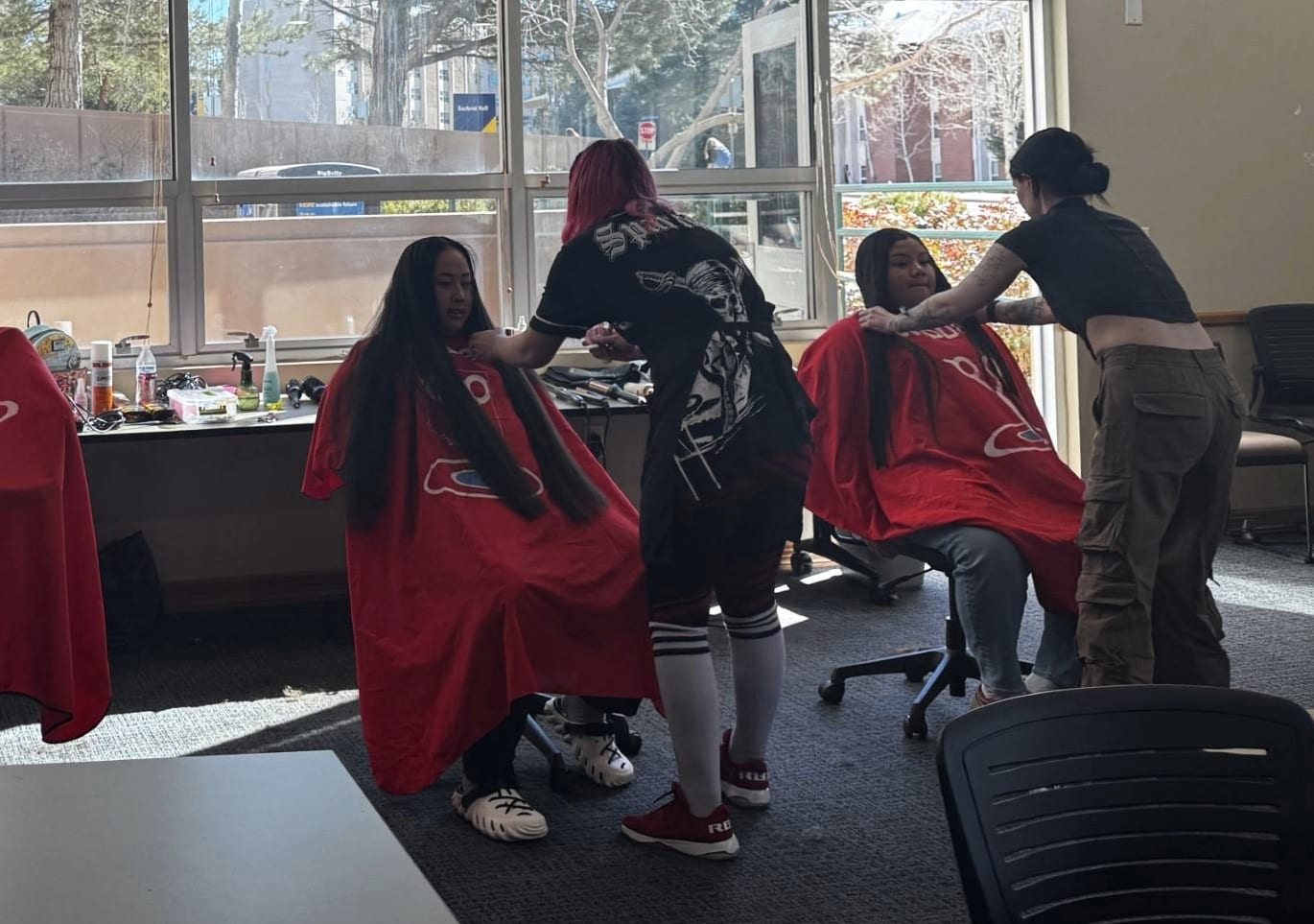 Two students getting their hair cut.
