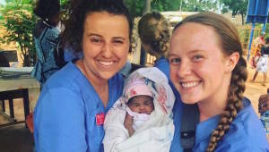 Nursing students with baby