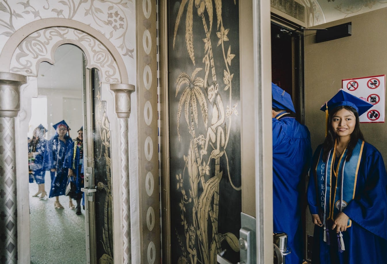 A group of people in blue robes

Description automatically generated