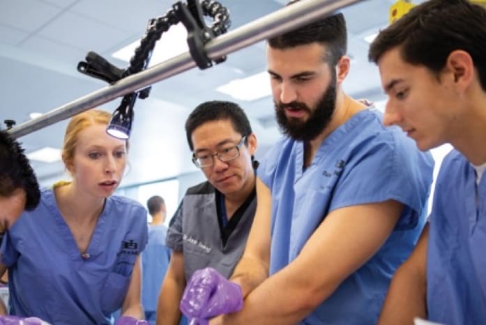 Group of medical student practicing a surgery.