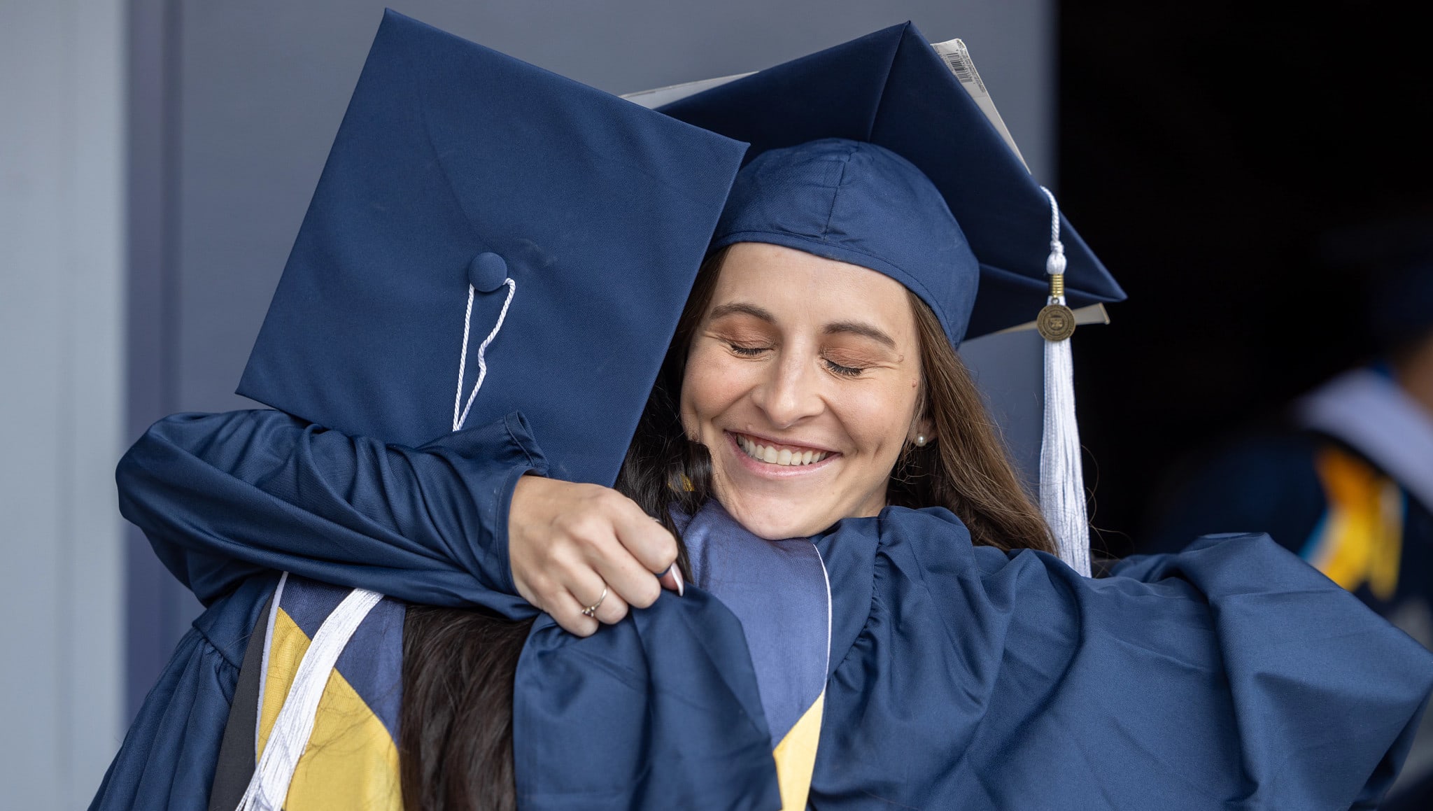 Graduates hugging