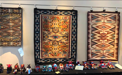 Rugs hanging on display