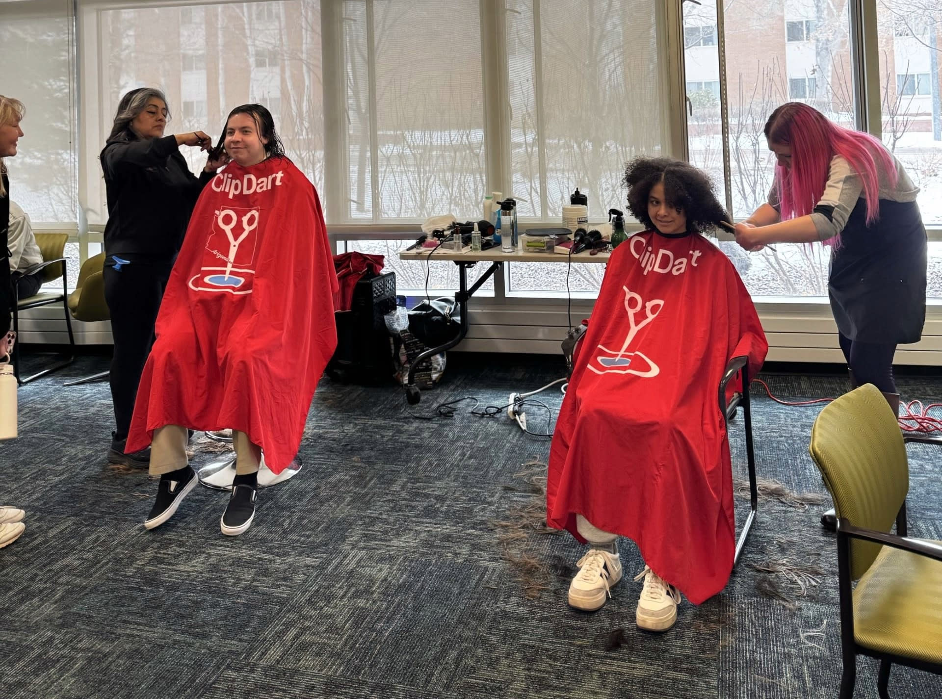 Two students getting their hair cut.