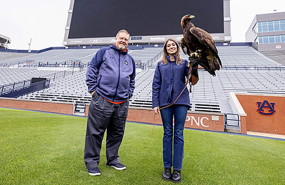 Holding eagle on field in Jordan-Hare Stadium