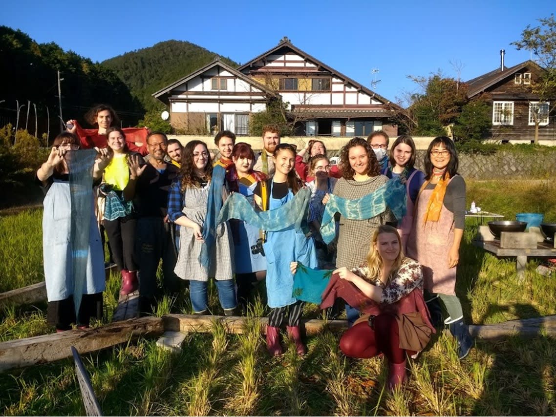 a group of students at a shibori dyeing facility in Japan