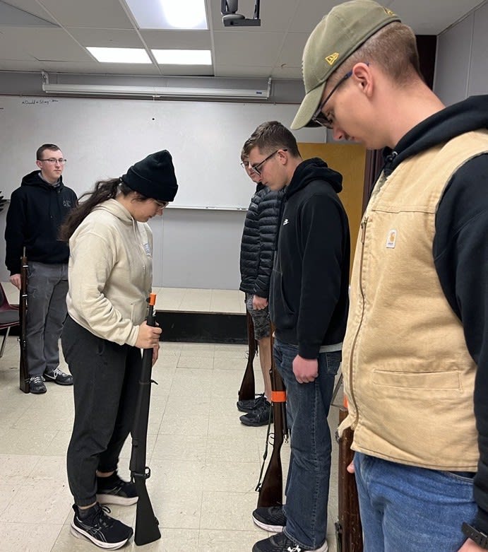 Students learning proper rifle technique