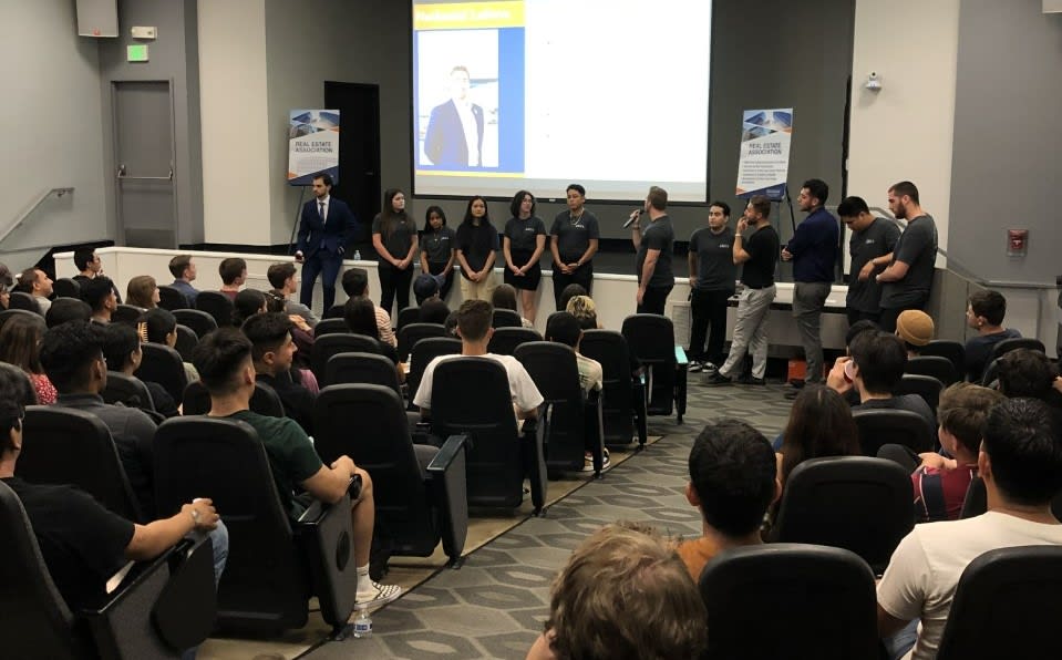 Real Estate Association Students presenting to potential real estate students