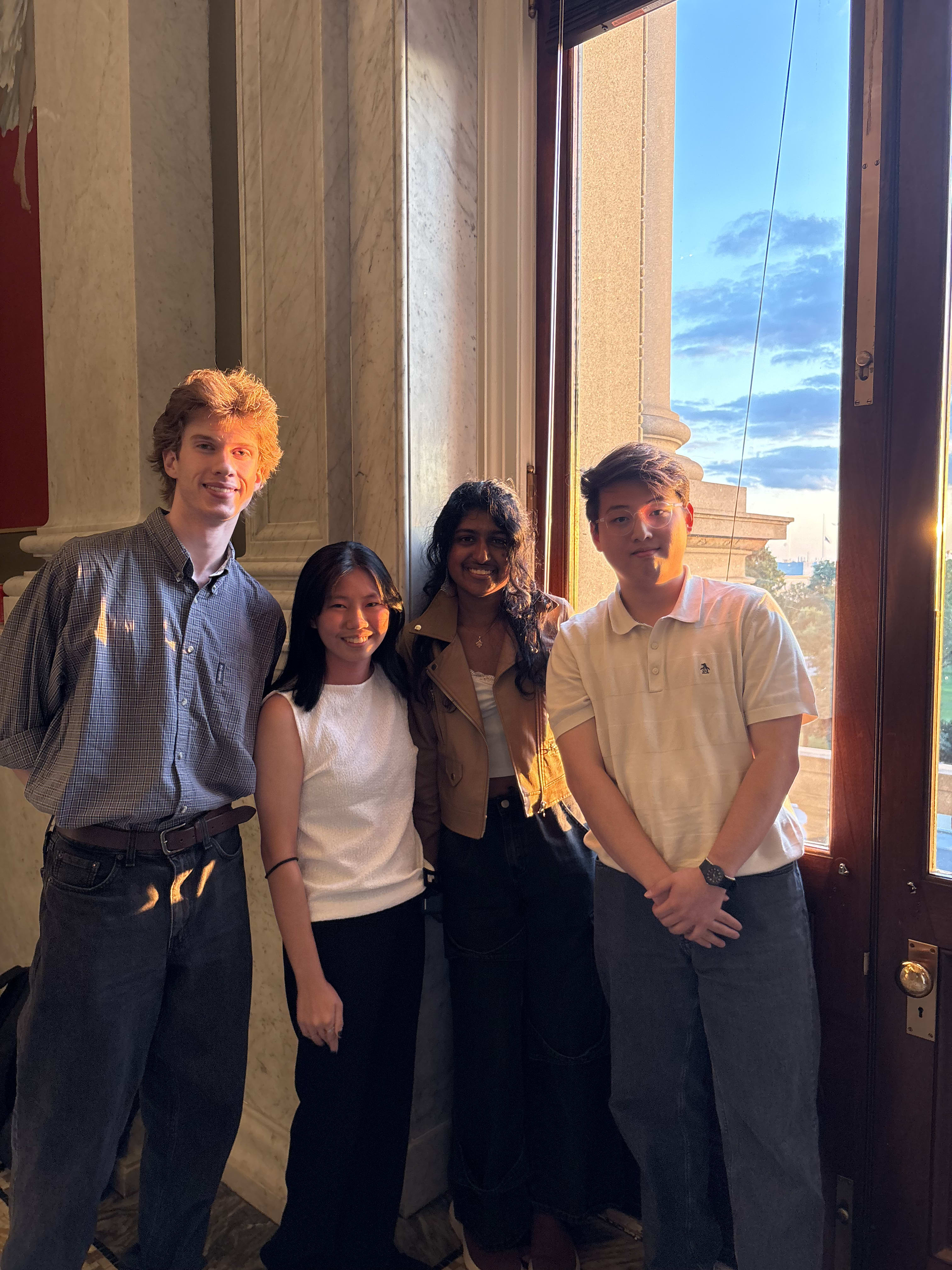 Eddie Chu and co-interns posing in the Library of Congress during happy hour.